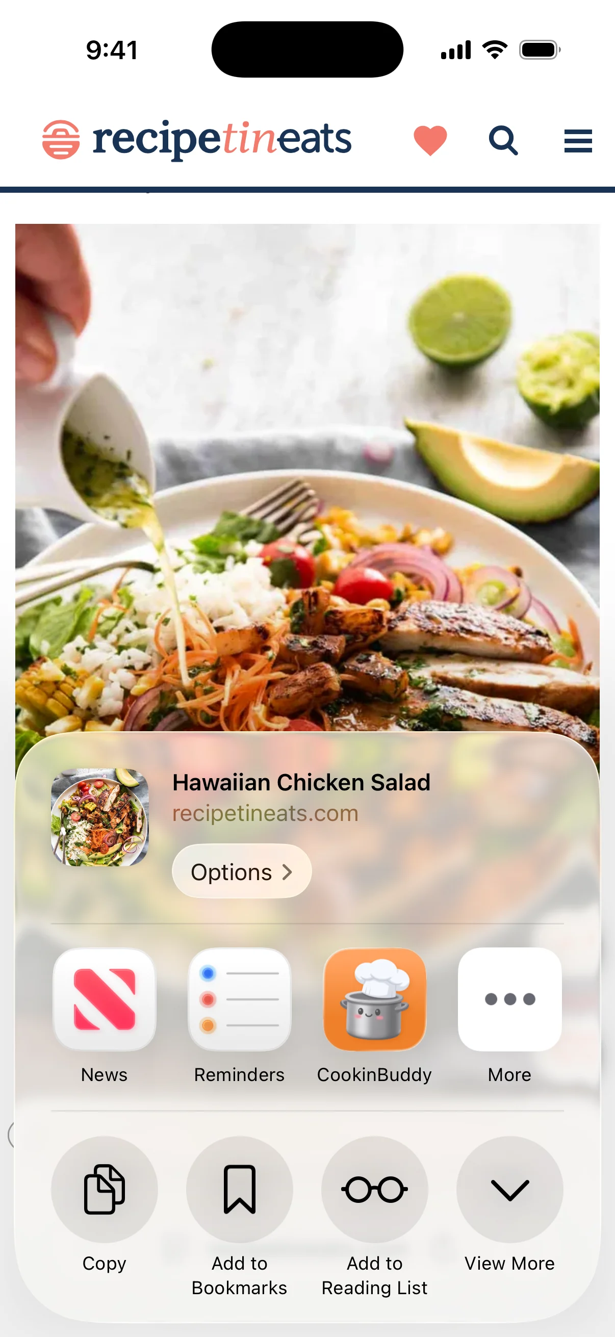 The iOS share sheet over a recipe page, with CookinBuddy next to News and Reminders